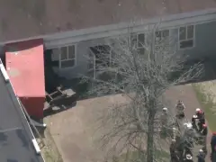 13 injured after truck slams into Devens building
