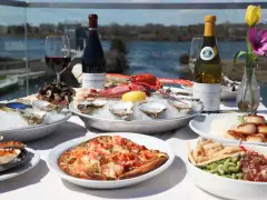 Matunuck Oyster Bar in Rhode Island reopens after fire under temporary tent